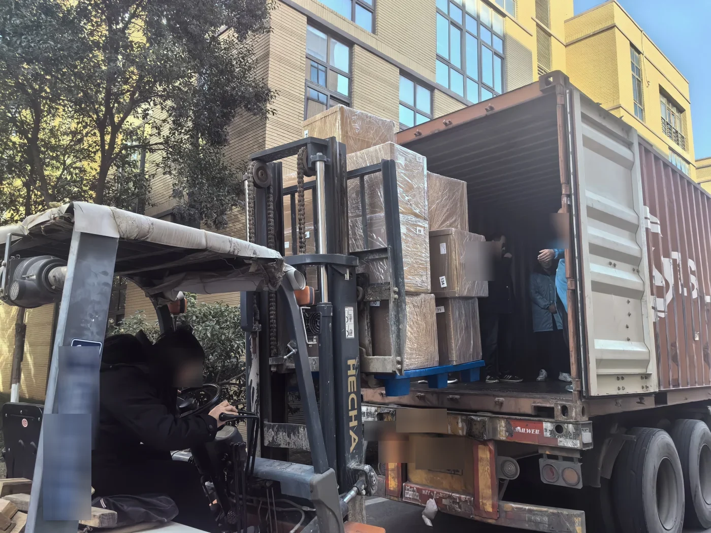 Forklift loading numbered cartons of PoE switches into a 20ft container for Dar es Salaam, Tanzania
